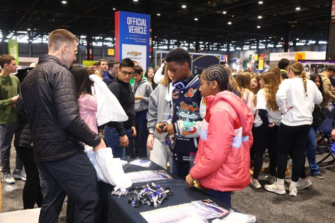 This is an image of students at the Chicago Auto Show 2024.