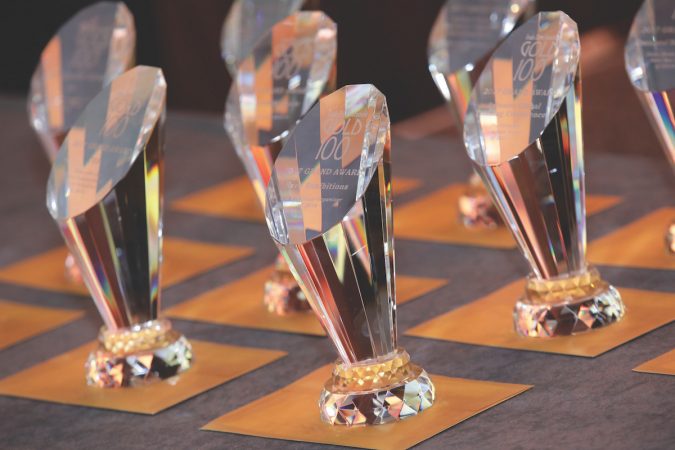 grand award crystal trophies on a table