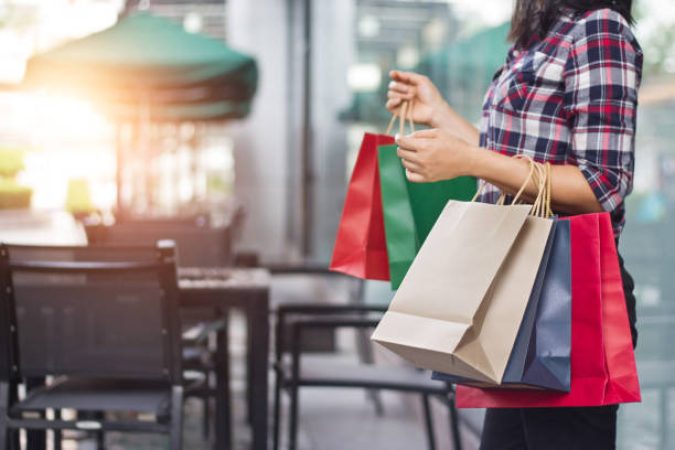 someone holding shopping bags