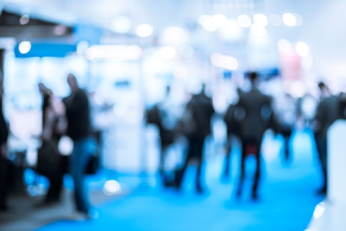 Defocused shot of crowd  on exhibition. Purposely blurred with a lens.