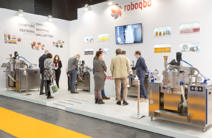 people in a booth at ProSweets Cologne 2023