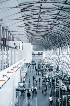 people in a crowded terminal setting